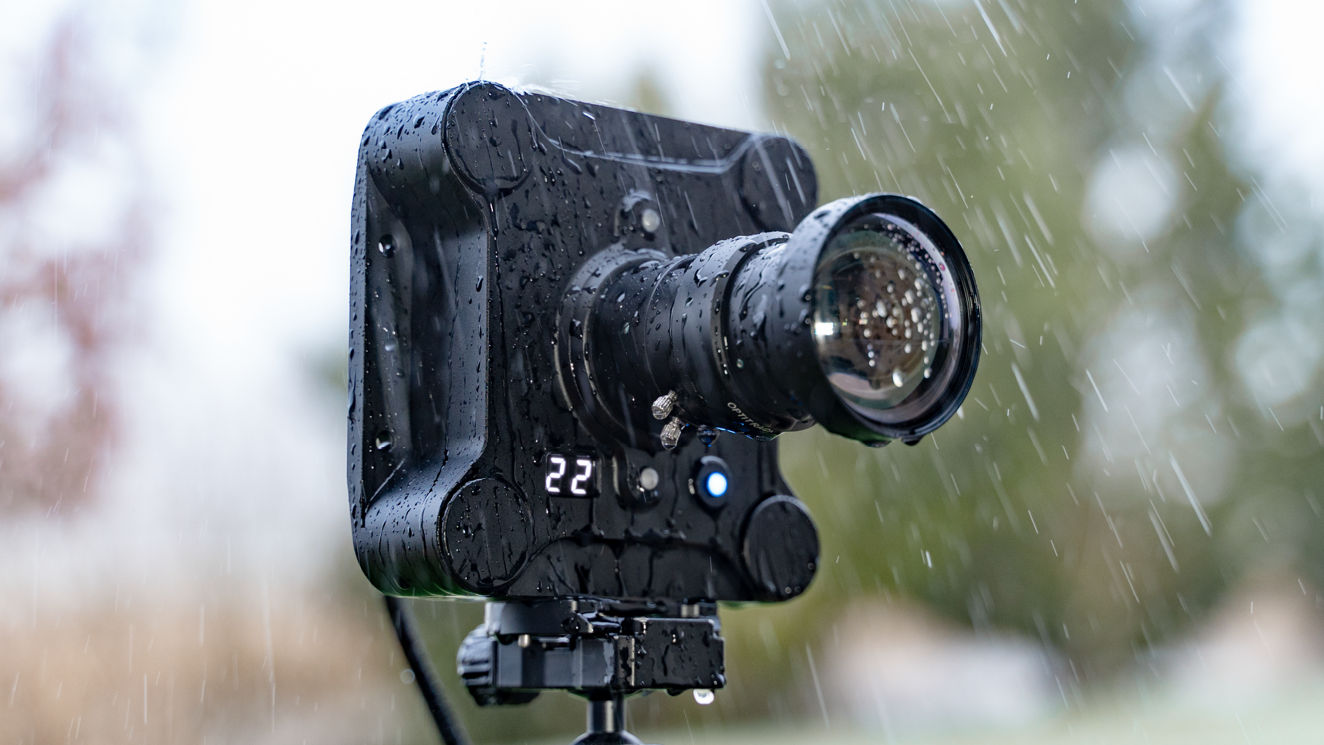 Versa camera on a tripod outside in the rain.